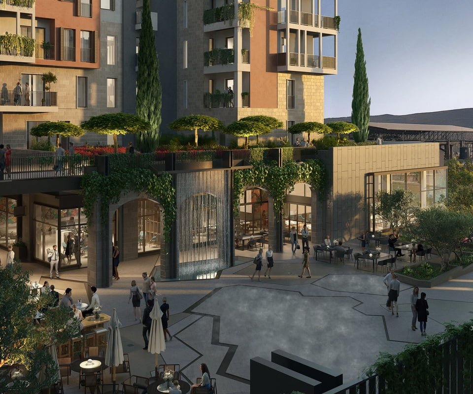 Twilight over a bustling outdoor plaza surrounded by modern apartment buildings with balconies lush with greenery, shops at ground level, and people mingling and enjoying the urban space.