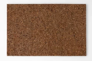 Textured brown artwork by Mila Halizova composed of numerous small, rounded elements.